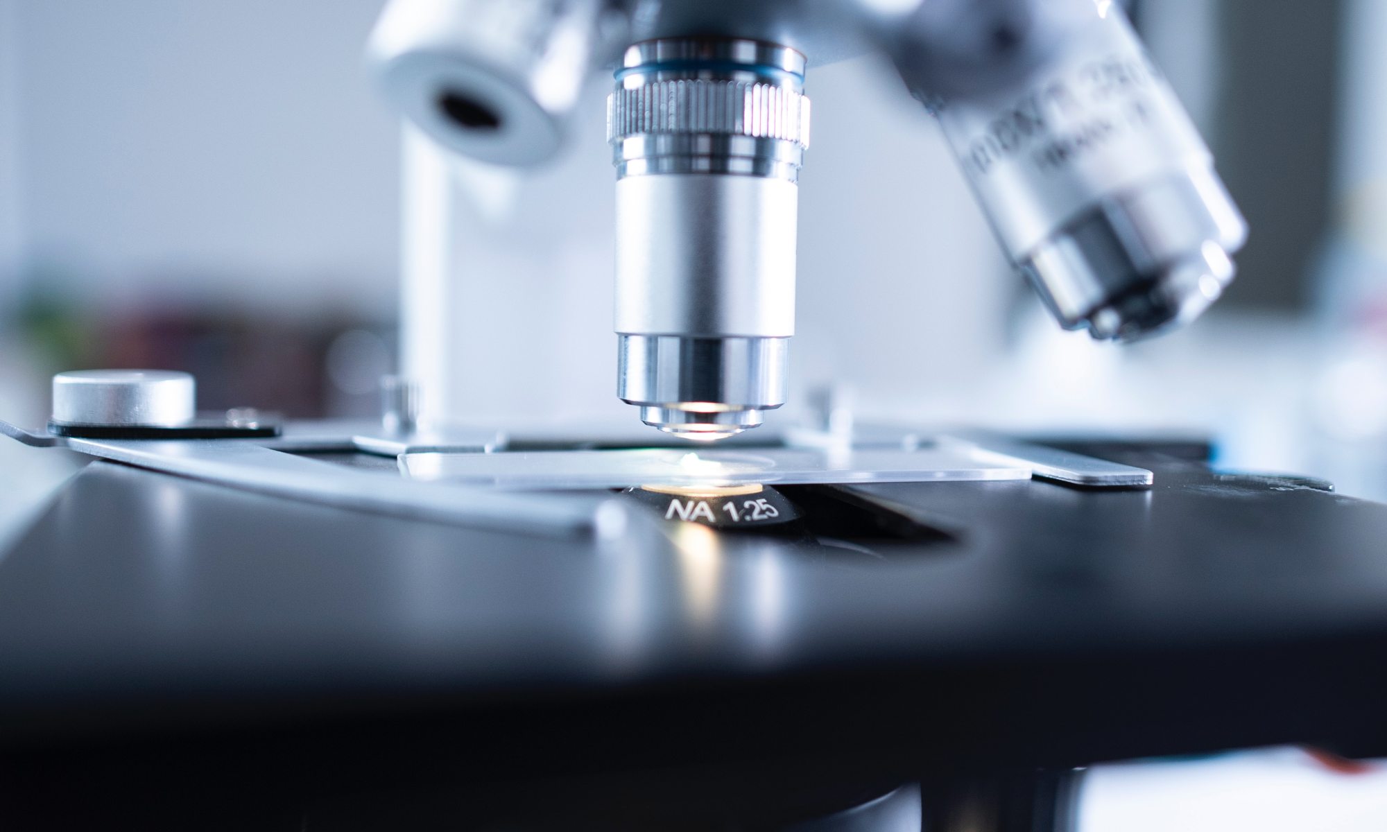 a microscope representing all of biology